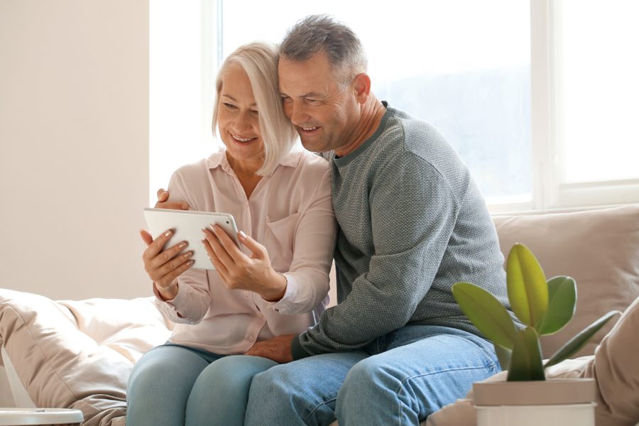 A couple reviewing their options together at home