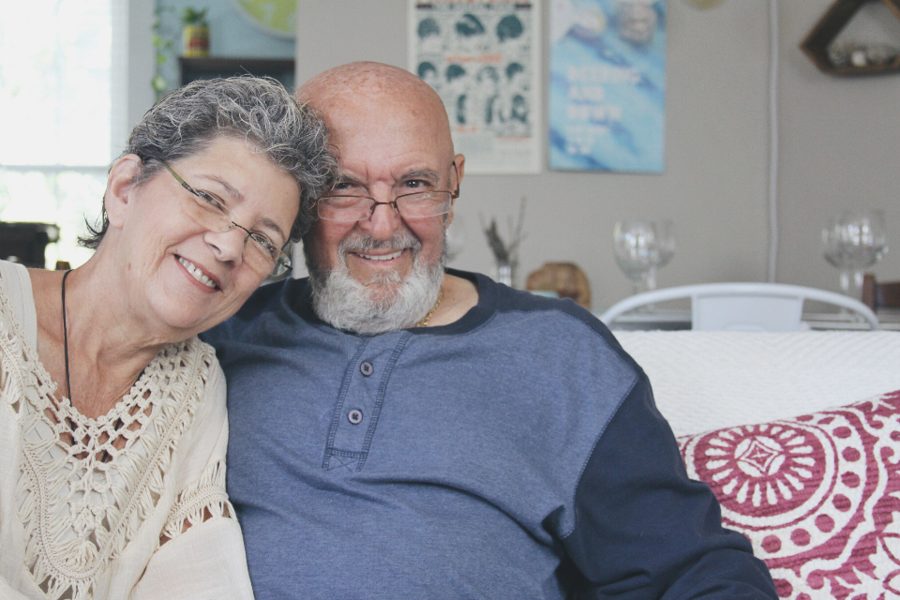 A happy couple relaxing at home